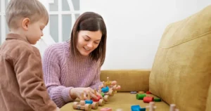 Sensory integration therapy session with child using toys to improve motor and sensory skills