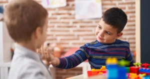 Two young children interacting