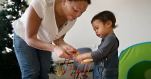 Therapist engaging a child in sensory integration therapy.